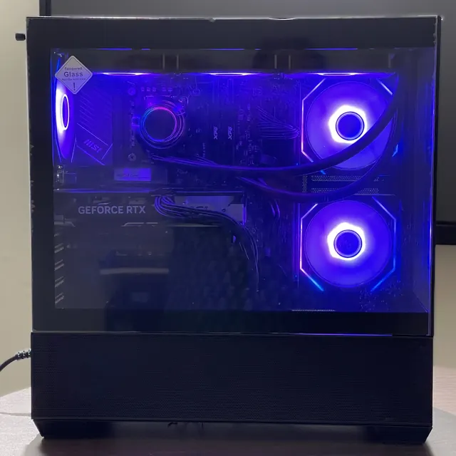 Custom PC with a tempered glass side panel and blue-lit fans