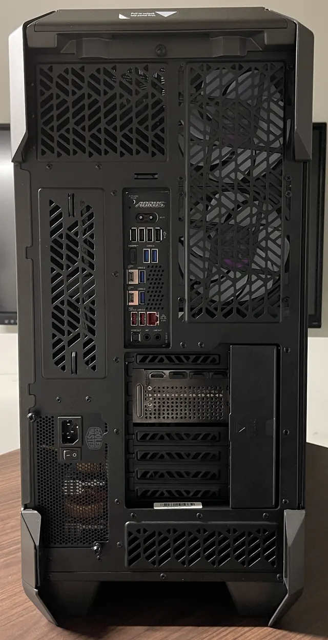 Rear of a tower PC showing the motherboard I/O and graphics card outputs